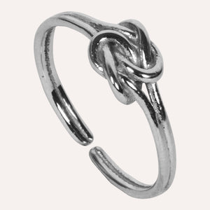 Aesthetically designed 925 sterling silver handmade adjustable ring. It is small, simple, delicate, elegant, light weight. Suitable for all occasions. Rhodium plating makes it less prone to tarnish. Completely hypoallergenic, allergy-free, nickel-free jewellery. Use as finger ring, above-knuckle ring, thumb band, stacking rings, stopper ring, mid finger ring or toe ring.  Ideal Christmas gift all age groups - teenage girls to mature ladies. Unique ring beautifully packaged in jewellery bag & box. 